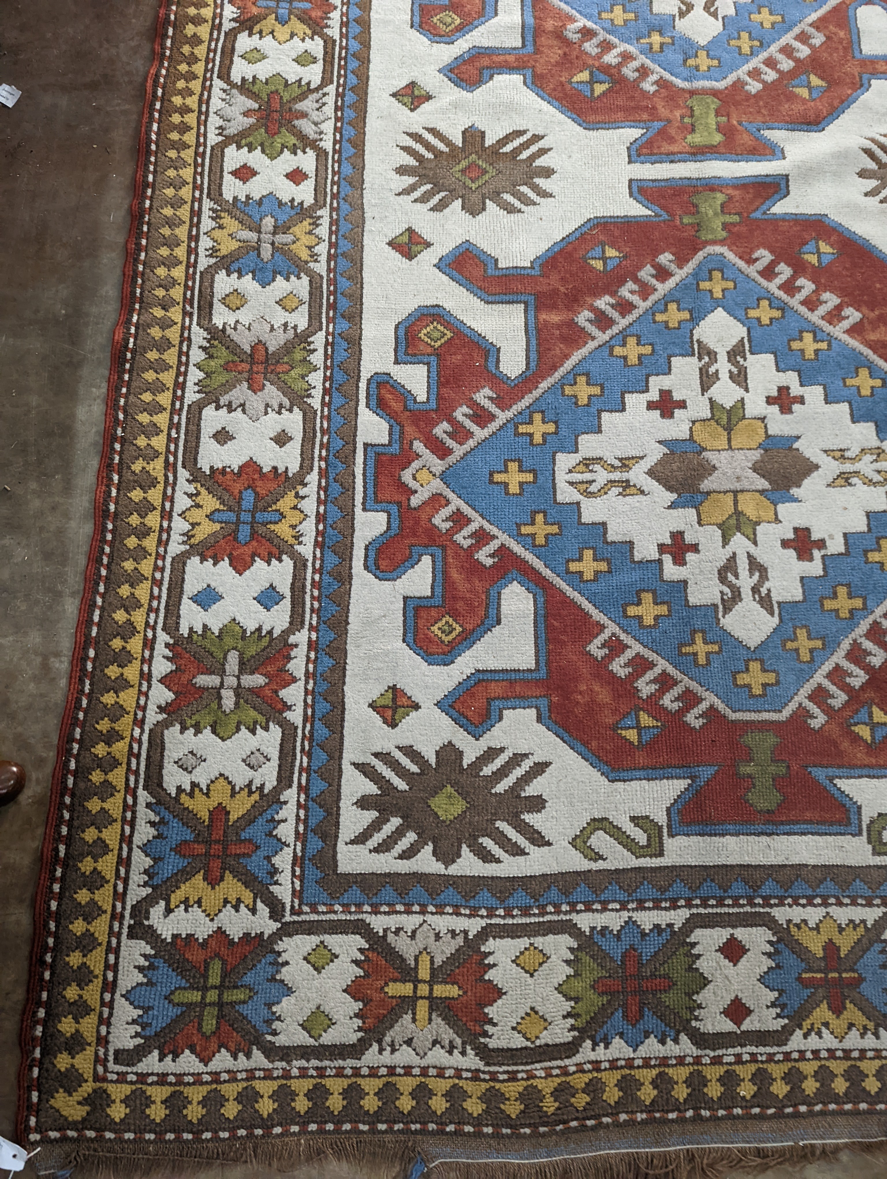 A Caucasian design ivory ground carpet, 270 x 170cm